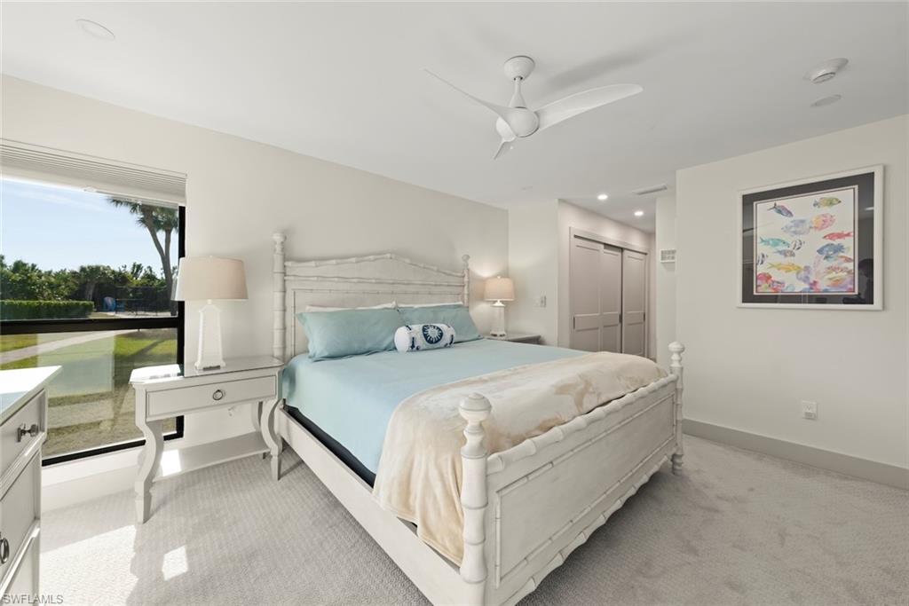 Bedroom featuring light carpet, a closet, a ceiling fan, and recessed lighting