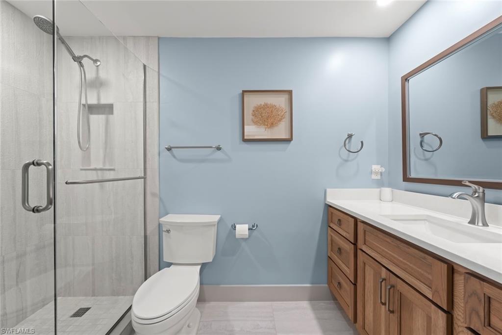 Bathroom with vanity and a shower stall