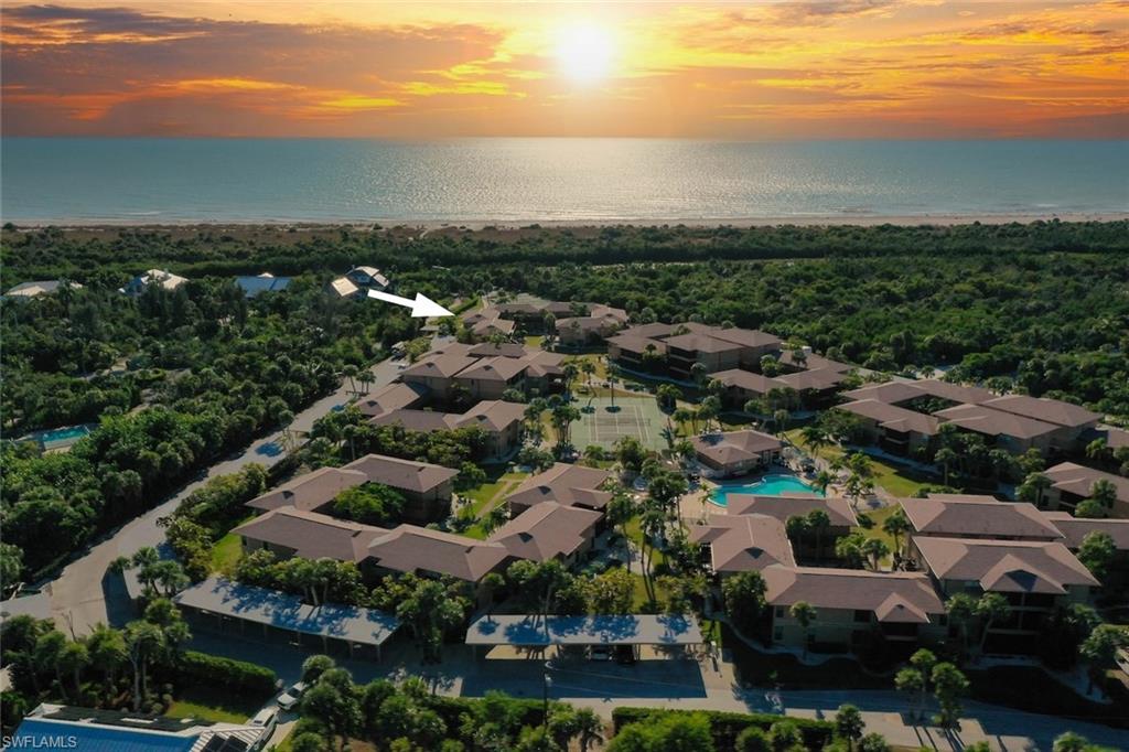 Aerial view of property and surrounding area featuring a large body of water
