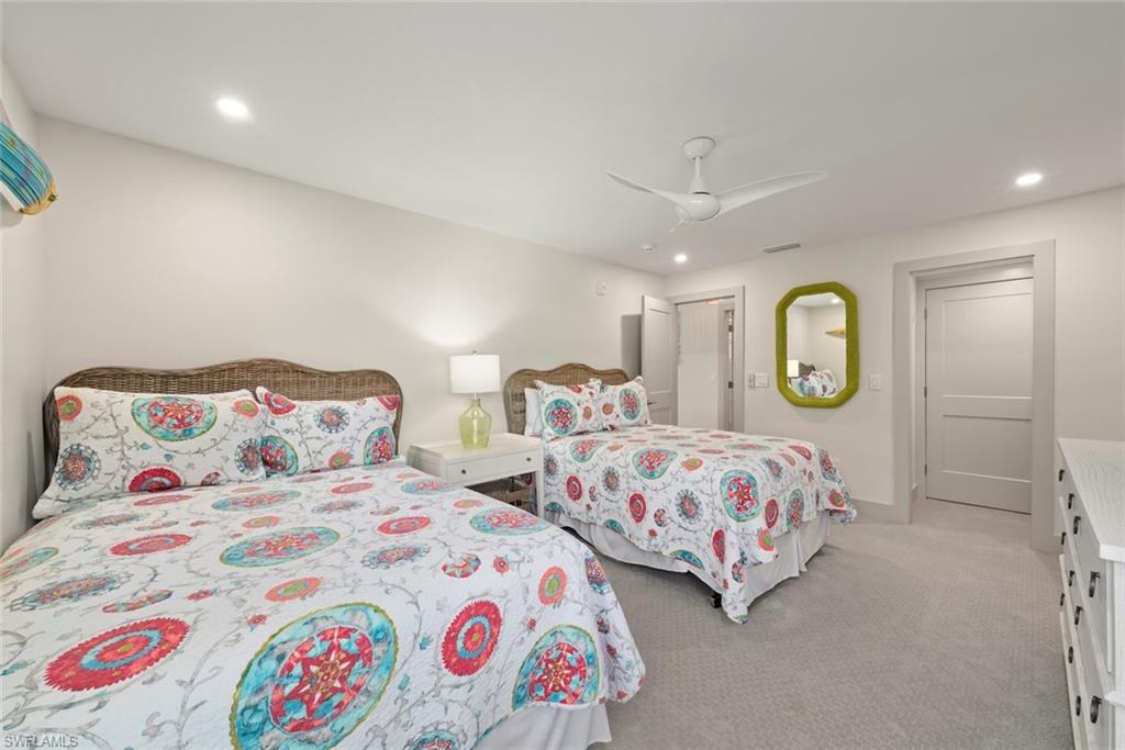 Bedroom featuring recessed lighting, light colored carpet, and a ceiling fan