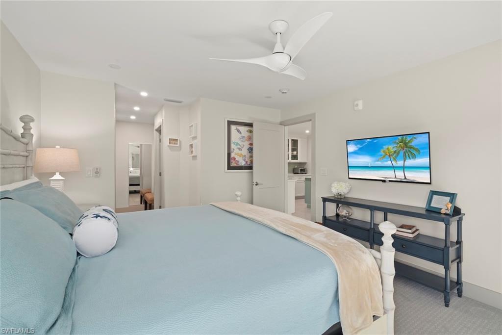 Bedroom with carpet, ceiling fan, and recessed lighting