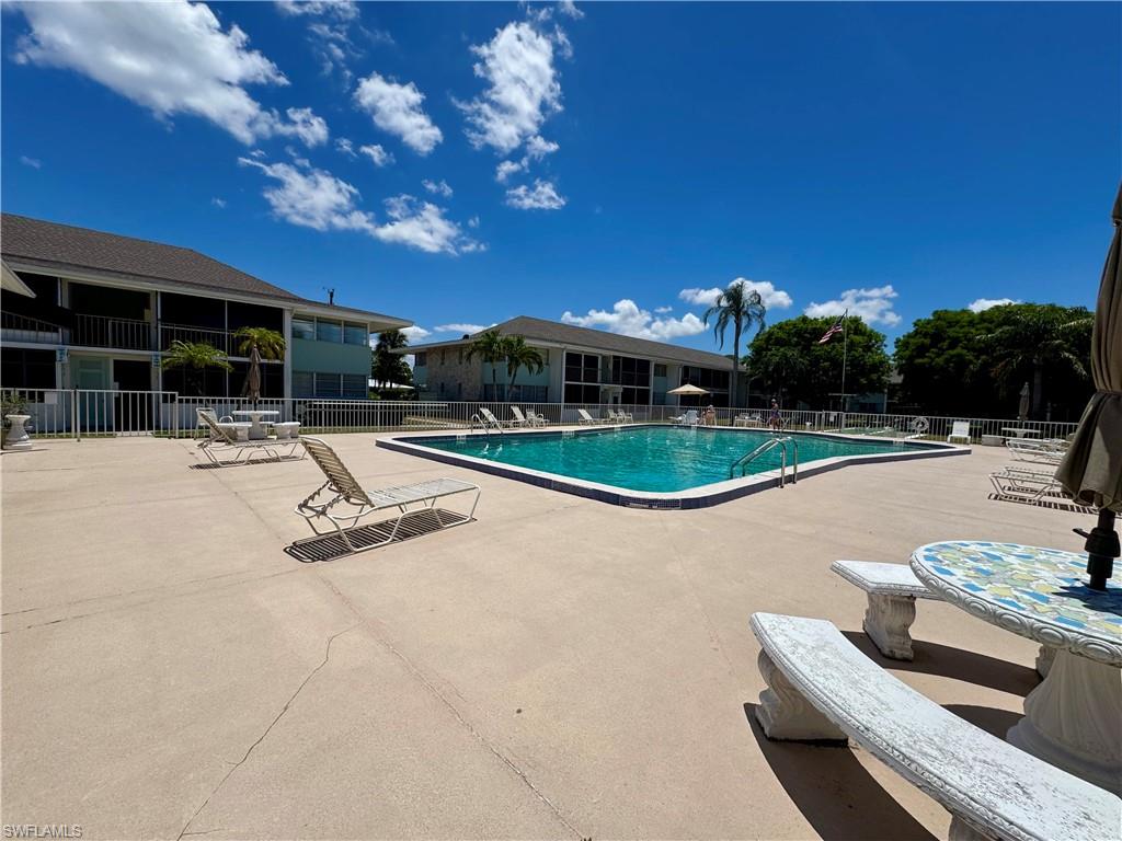 Community pool featuring a patio area