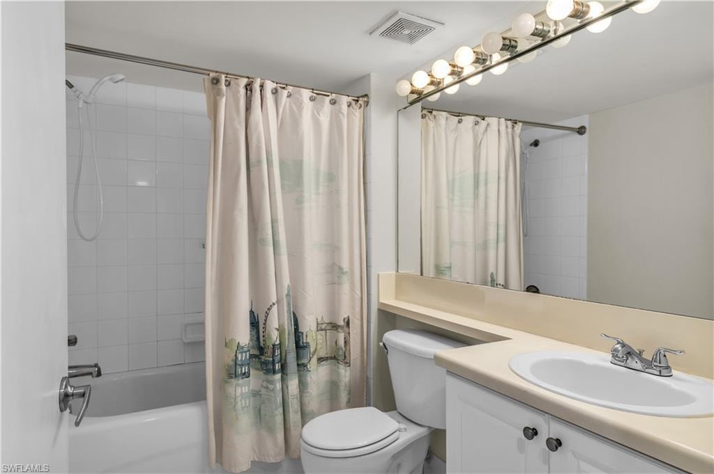 Full bathroom with vanity and shower / tub combo with curtain