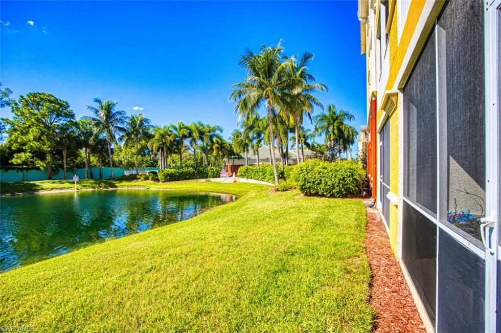 View of yard with a water view