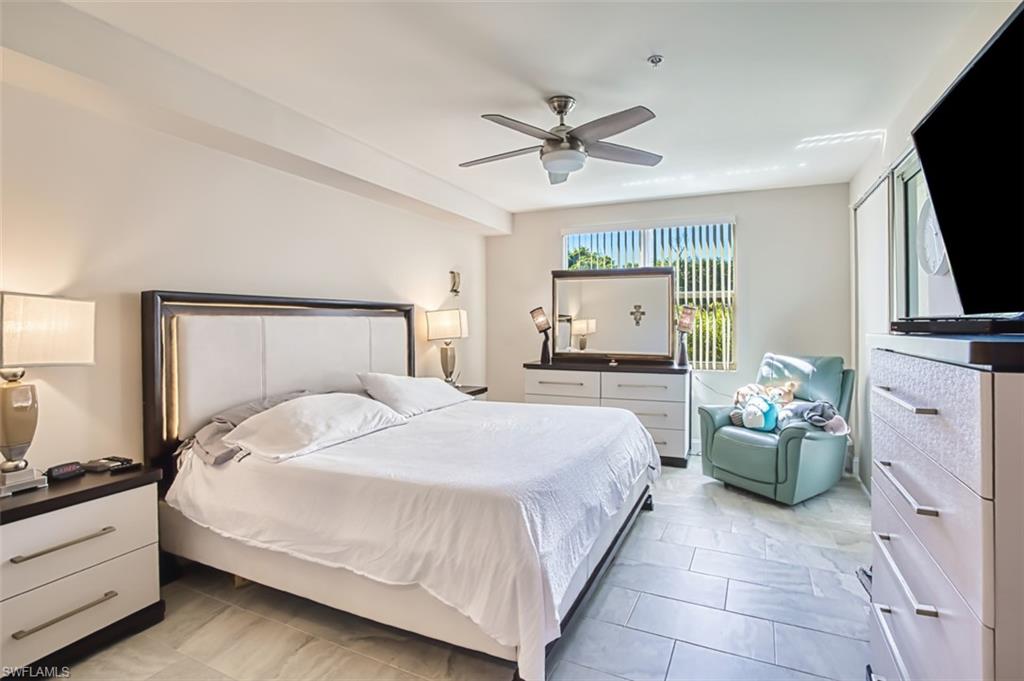 Bedroom featuring a ceiling fan and light tile patterned flooring