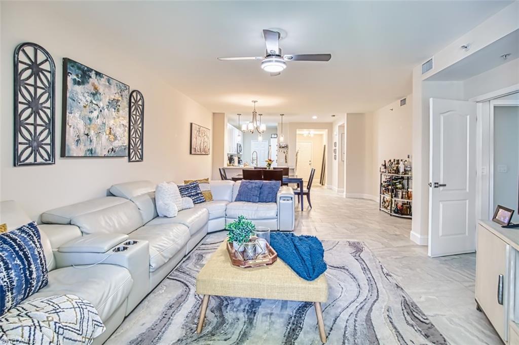 Living area with ceiling fan and a chandelier