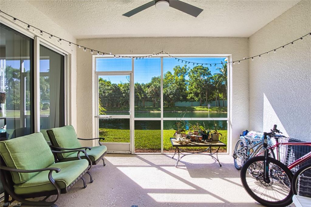 Sunroom / solarium with a water view