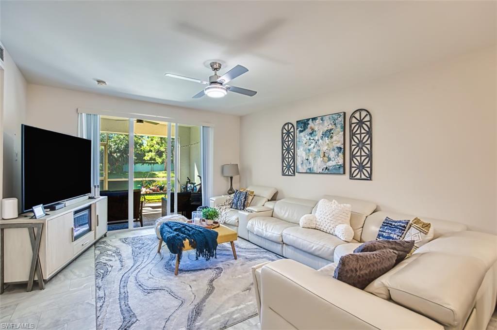 Living room featuring ceiling fan