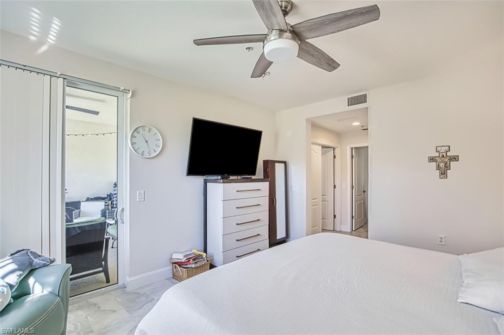Bedroom featuring ceiling fan and baseboards