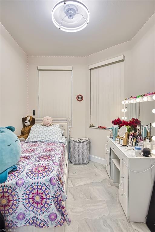 Bedroom featuring baseboards