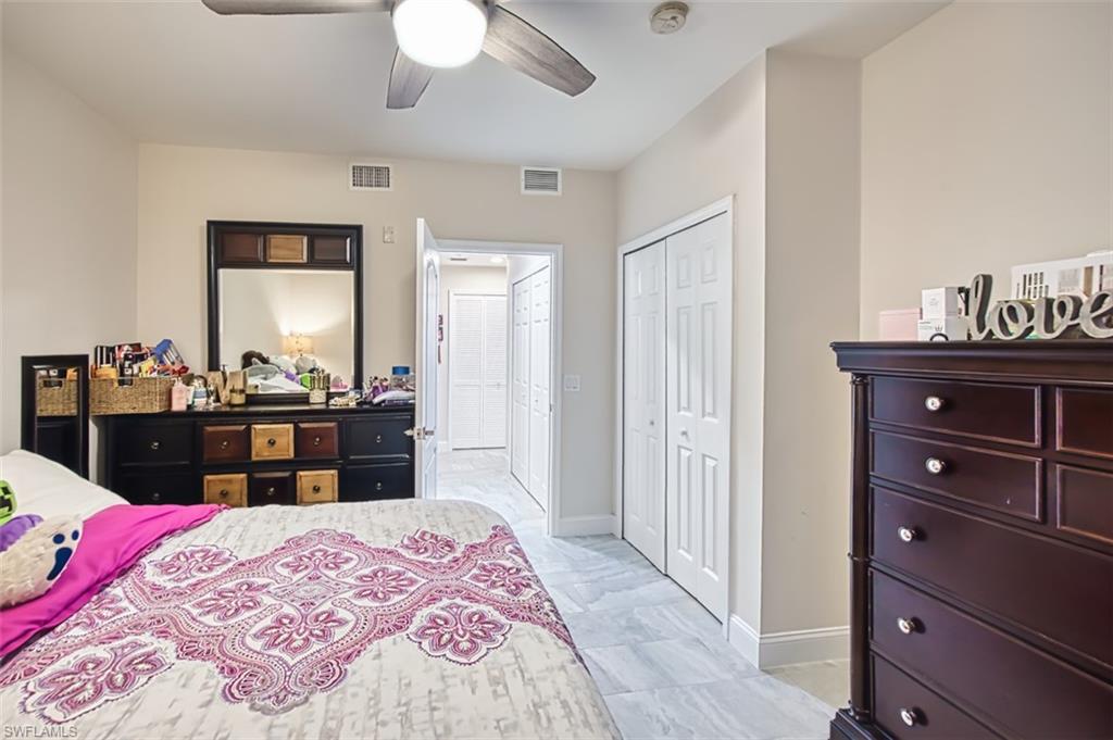 Bedroom featuring a ceiling fan and a closet