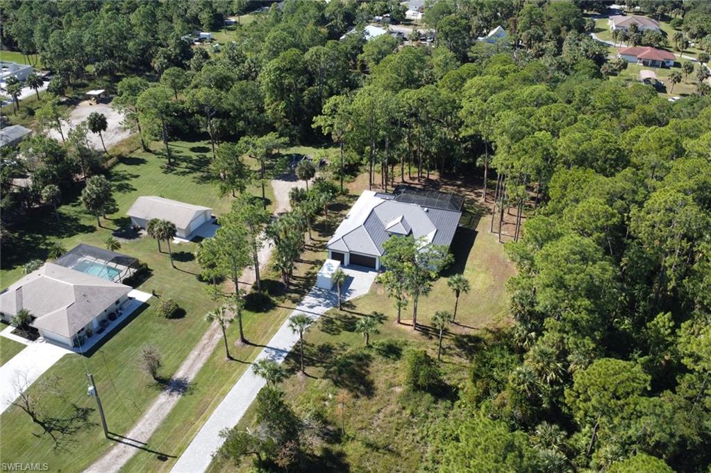 Aerial overview of property's location featuring a heavily wooded area