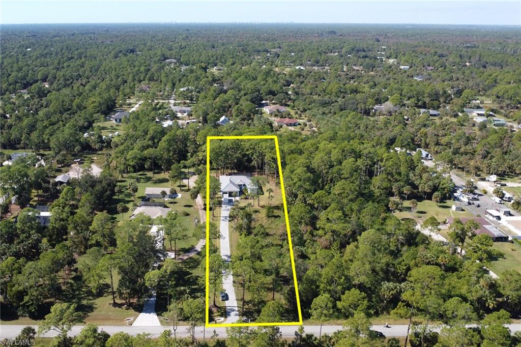 View of property location featuring property parcel outlined and a heavily wooded area