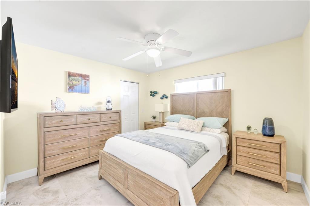 Bedroom featuring a ceiling fan and a closet