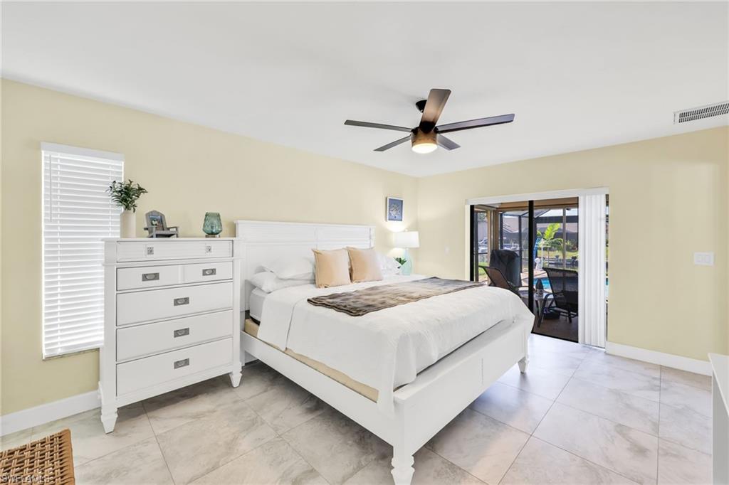 Bedroom featuring access to exterior and ceiling fan