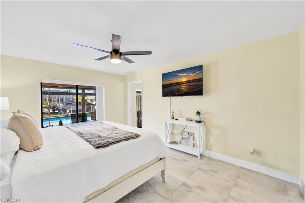 Bedroom with access to outside and ceiling fan