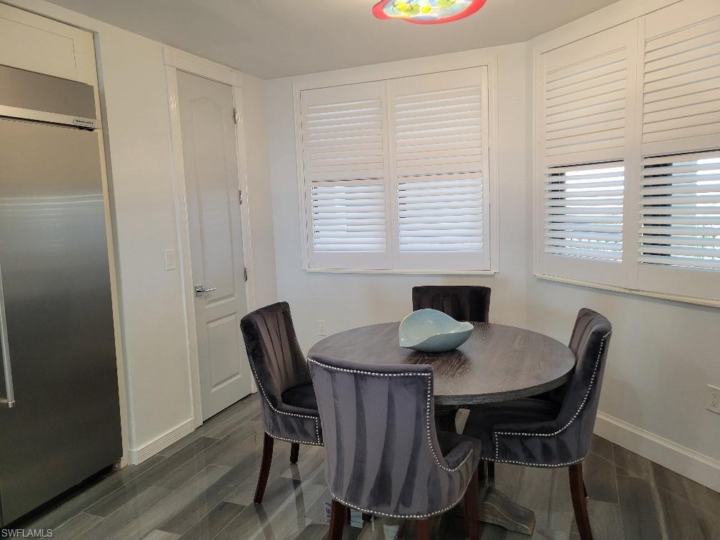 Dining space featuring wood tiled floors