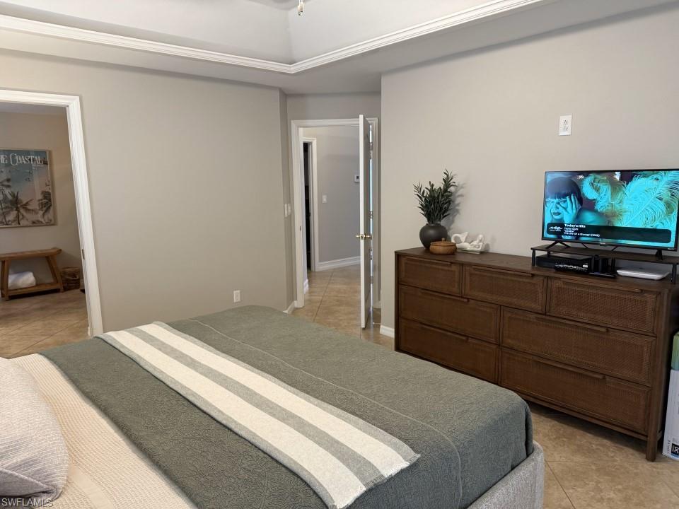 Bedroom featuring light tile patterned flooring
