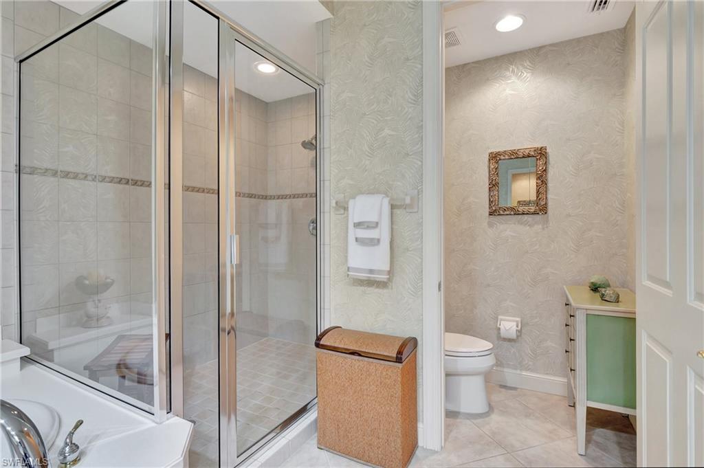 Bathroom with tile patterned flooring, a stall shower, wallpapered walls, a tub, and recessed lighting