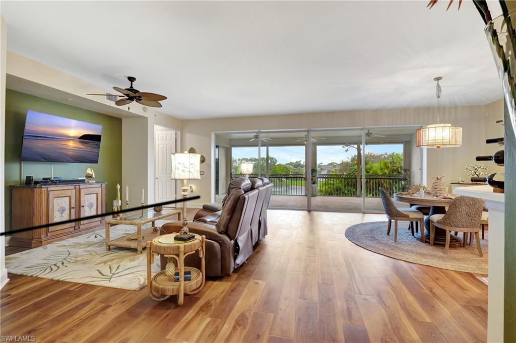 Living room featuring light wood-style flooring and ceiling fan