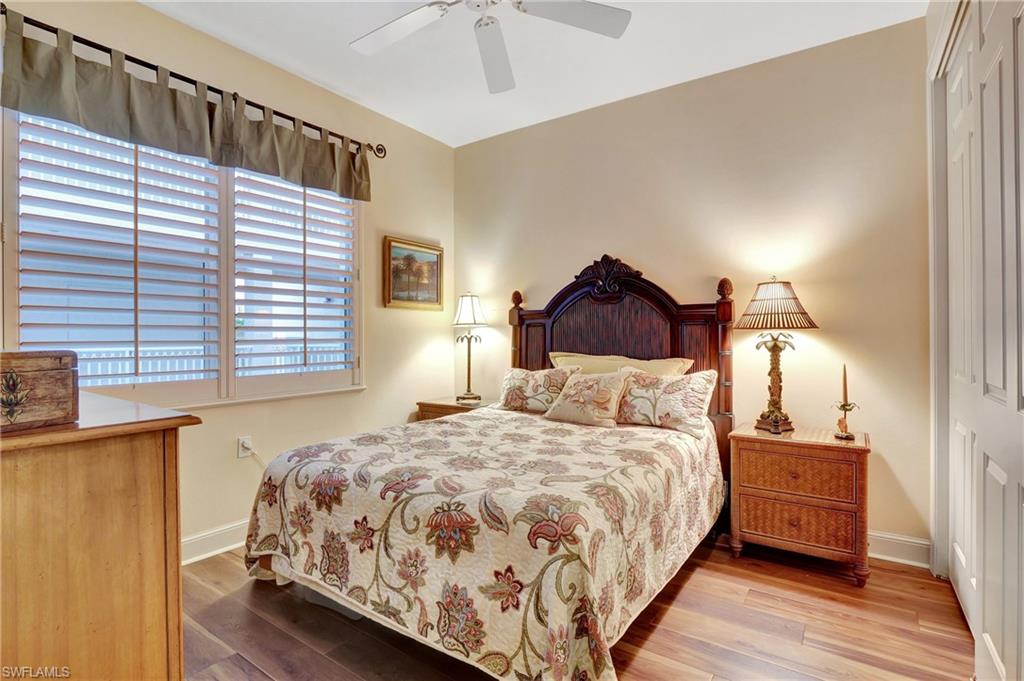 Bedroom with light wood finished floors and ceiling fan