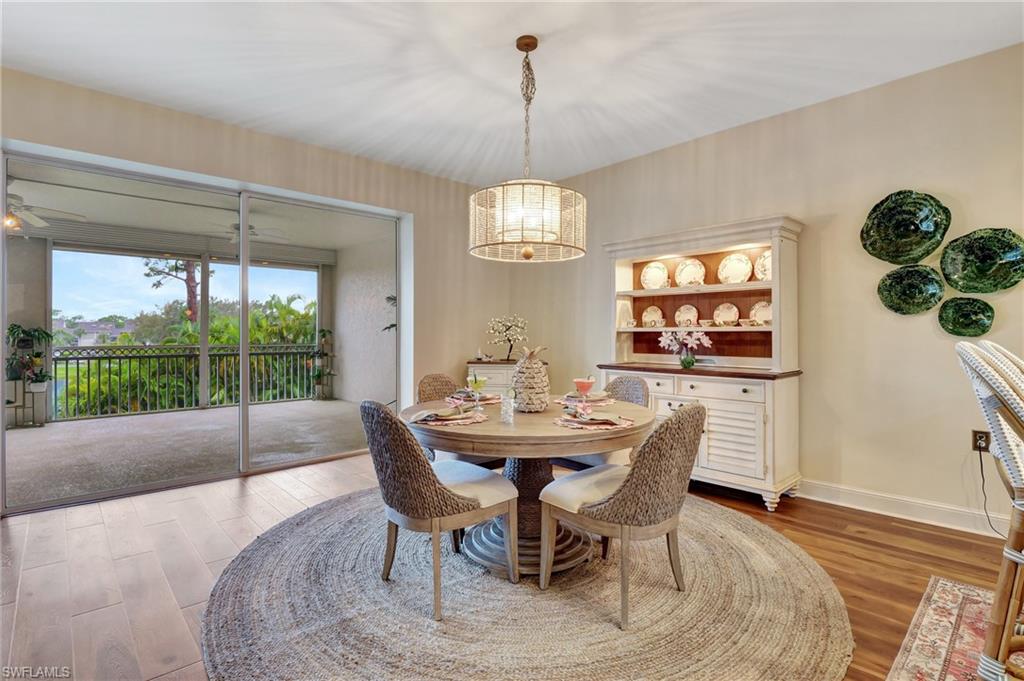 Dining area featuring light wood-style flooring and baseboards