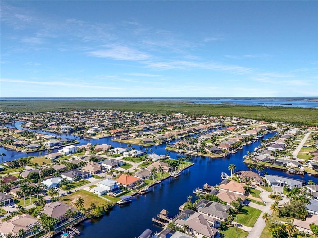 This home sits on an extra-wide canal, offering stunning water views, added privacy, and plenty of space for boating and outdoor enjoyment.