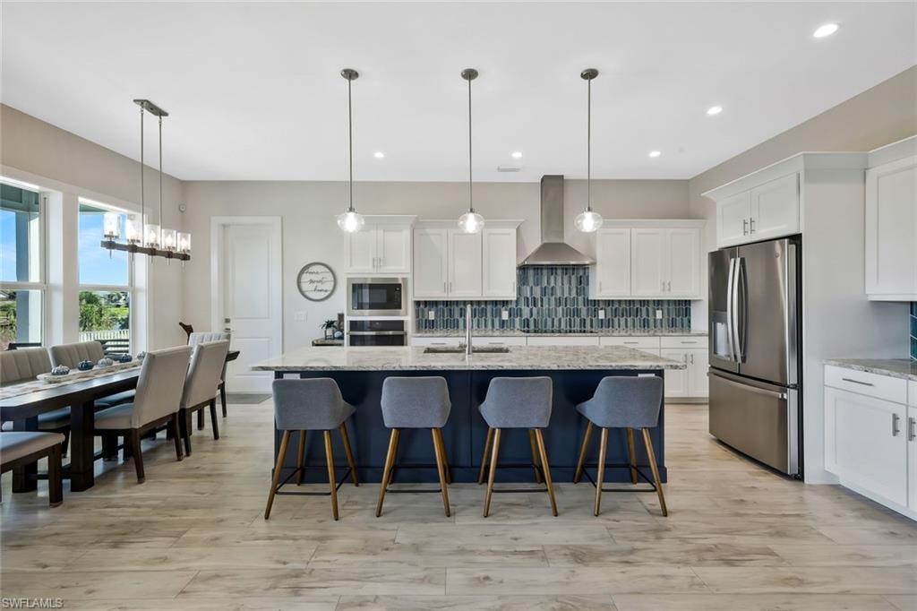 The open-concept entertaining area offers abundant seating, perfect for hosting family dinners or casual gatherings with friends.