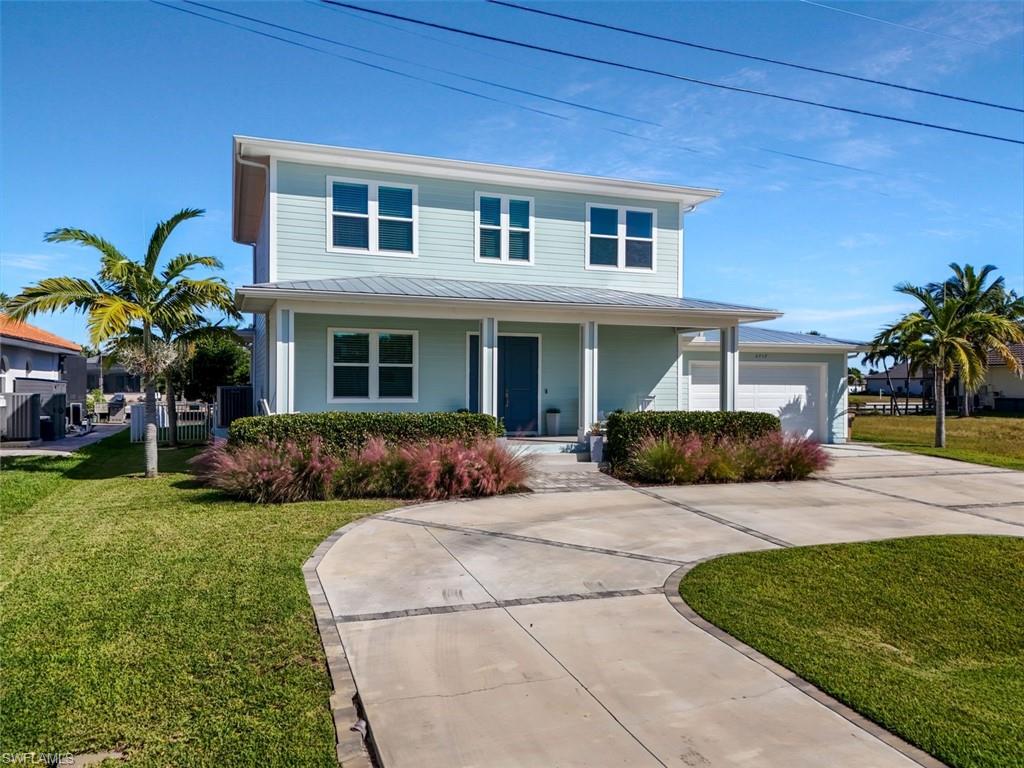 This home embodies a Florida coastal look with light, airy spaces, soft coastal hues, and breezy indoor-outdoor living.
