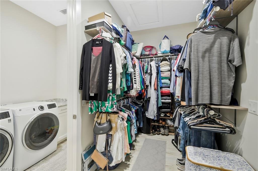 Primary Walk-in Closet with access to laundry room.