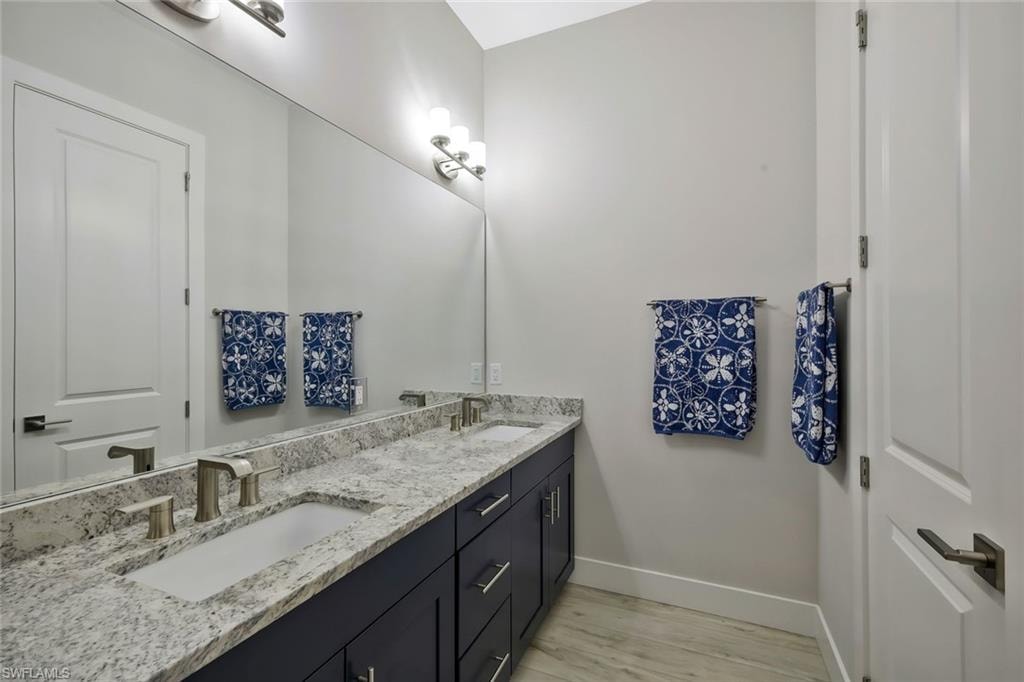 Primary Bath with duel sinks and separated watercloset.