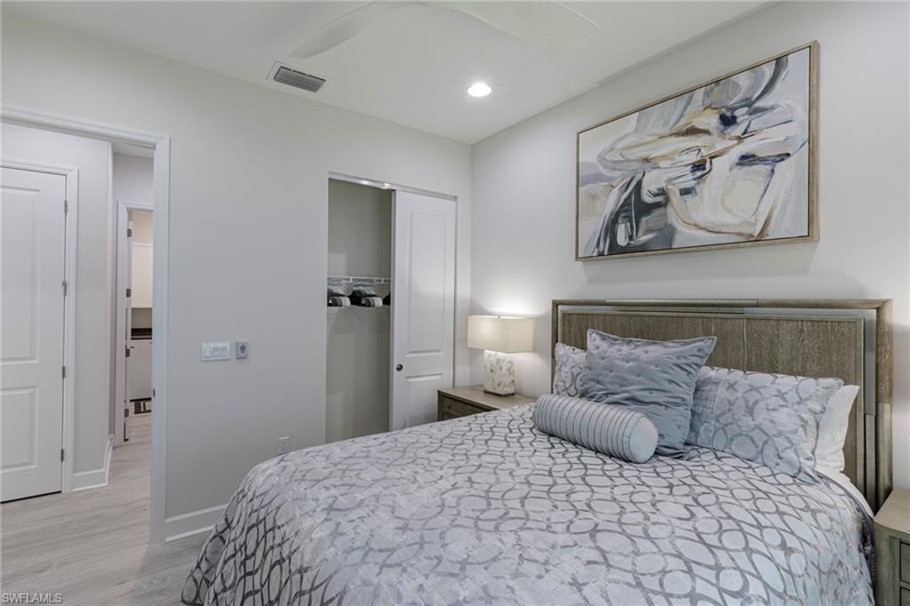 Bedroom featuring a closet, light wood-type flooring, and ceiling fan