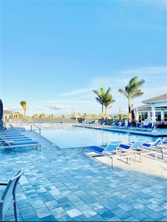 Community pool featuring a patio