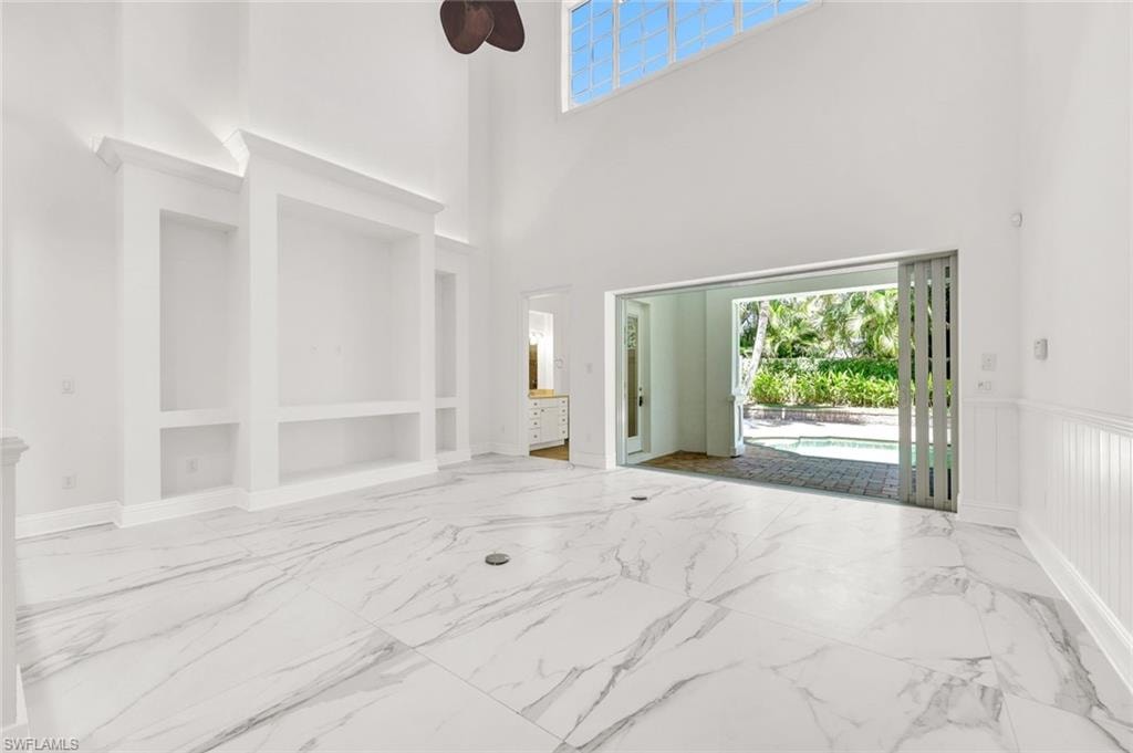 Family-room with a view of the pool and lanai.