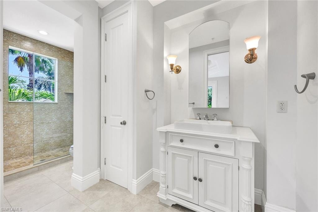 Front guest-bathroom with walk in shower and large walk-in closet.