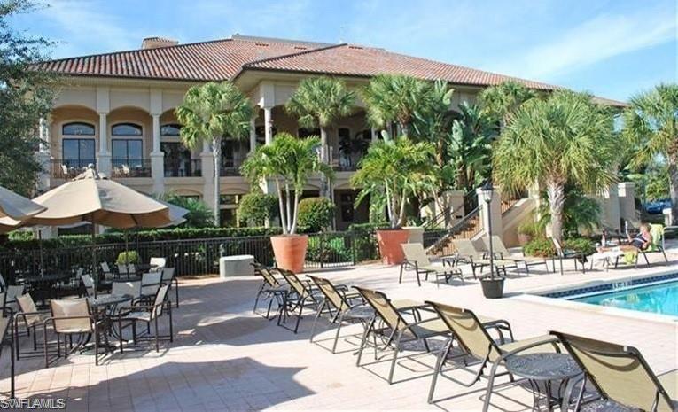 Community pool featuring a patio