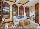 Living room with coffered ceiling and beam ceiling