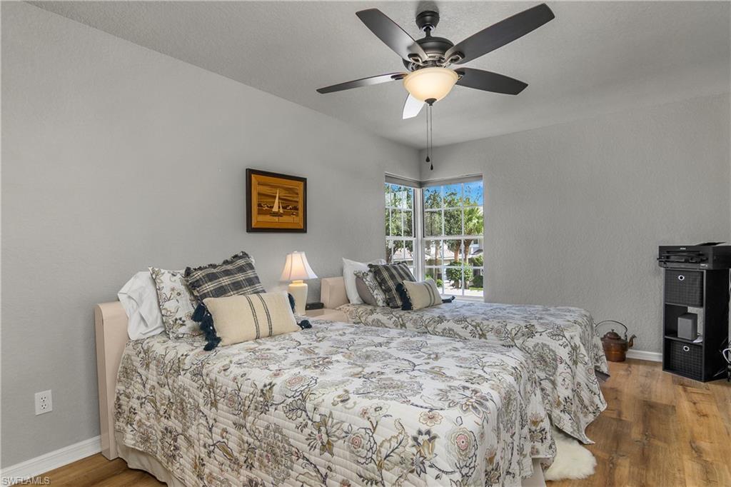 Bedroom featuring light wood-style flooring and ceiling fan