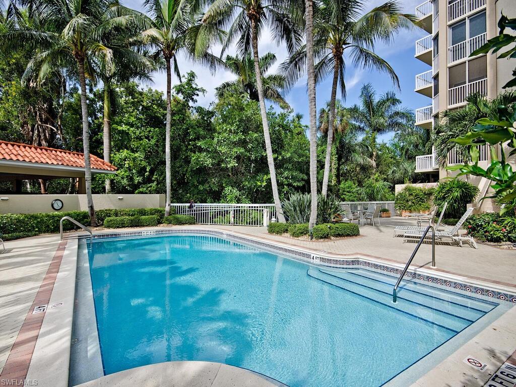 Community pool with a patio