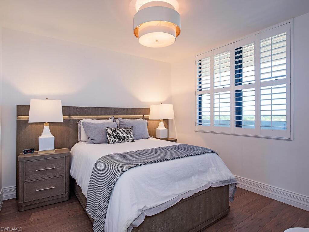 Bedroom with dark wood-type flooring
