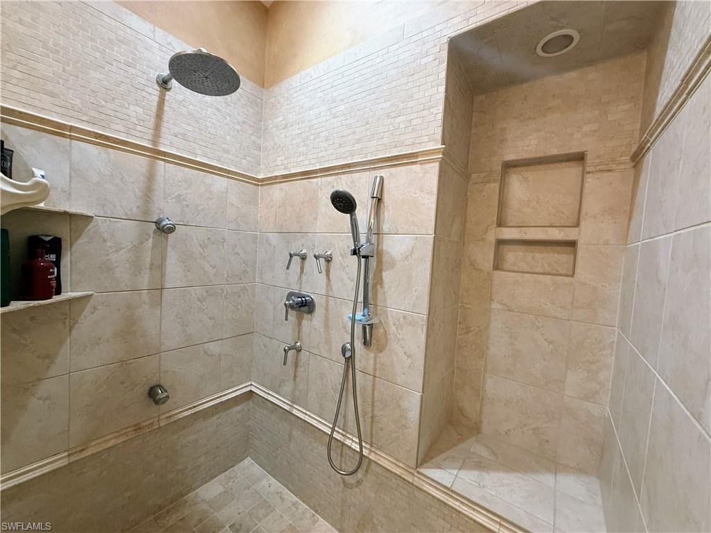 Full bathroom featuring a tile shower