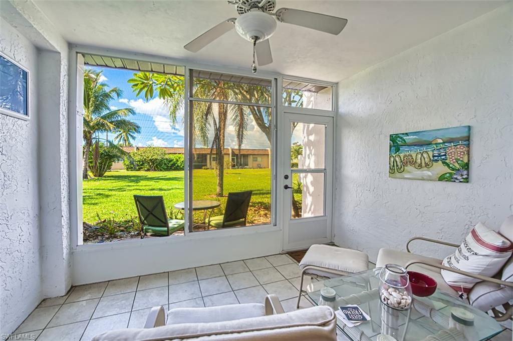 Sunroom featuring a ceiling fan