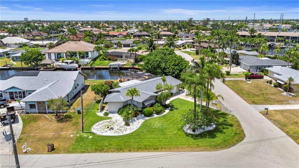 Aerial perspective of suburban area with a large body of water
