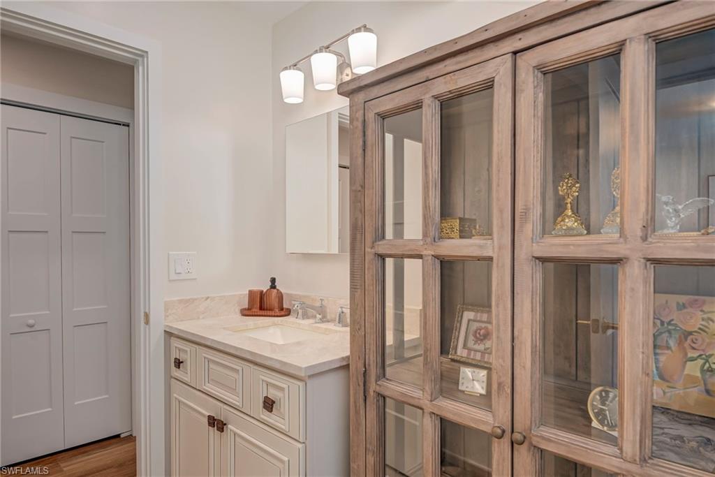 Bathroom featuring vanity and wood finished floors