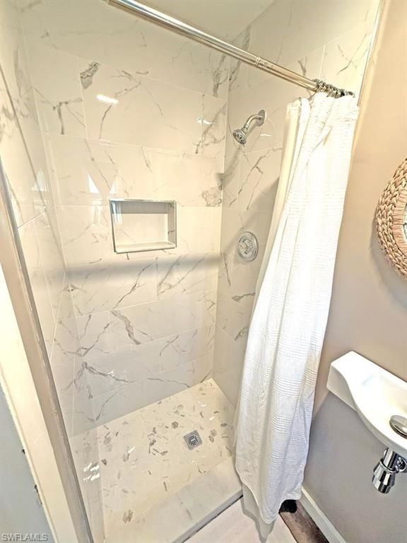 Full bathroom with a stall shower