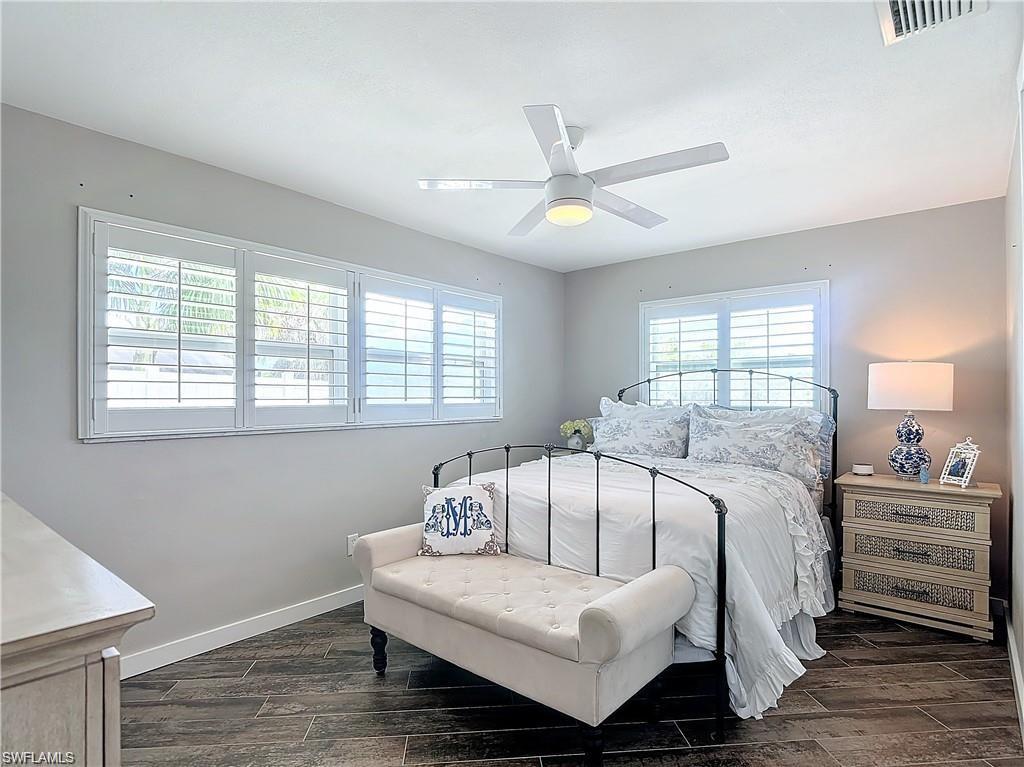 Bedroom featuring wood finish floors and a ceiling fan