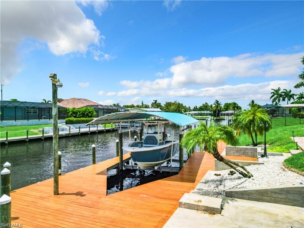 Dock with boat lift and a water view