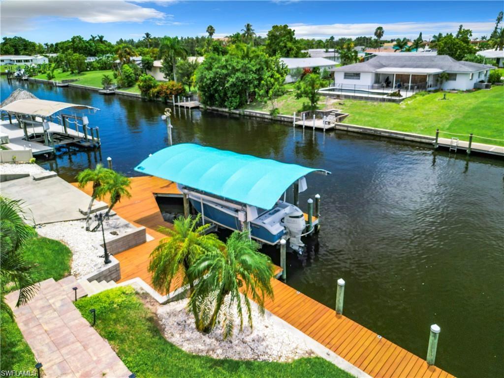 Dock with boat lift and a water view. ( No Canopy)