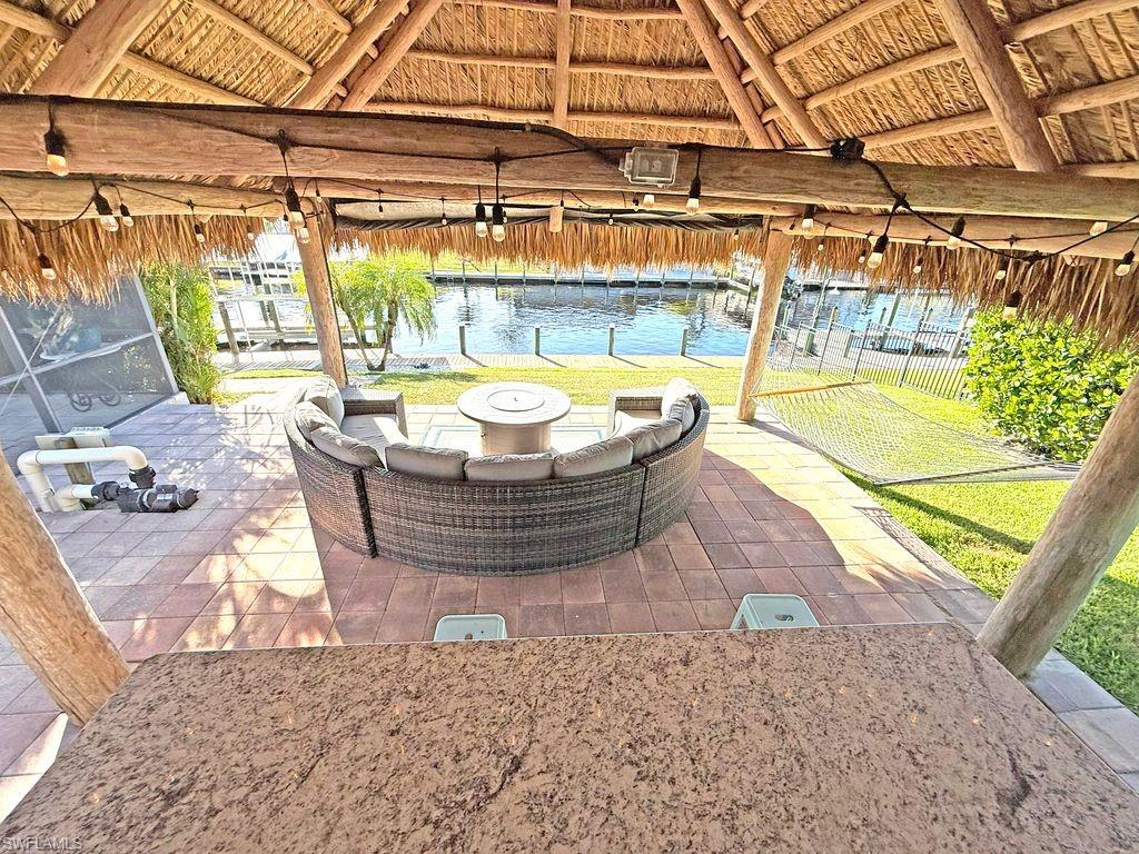 View of patio / terrace with an outdoor fire pit