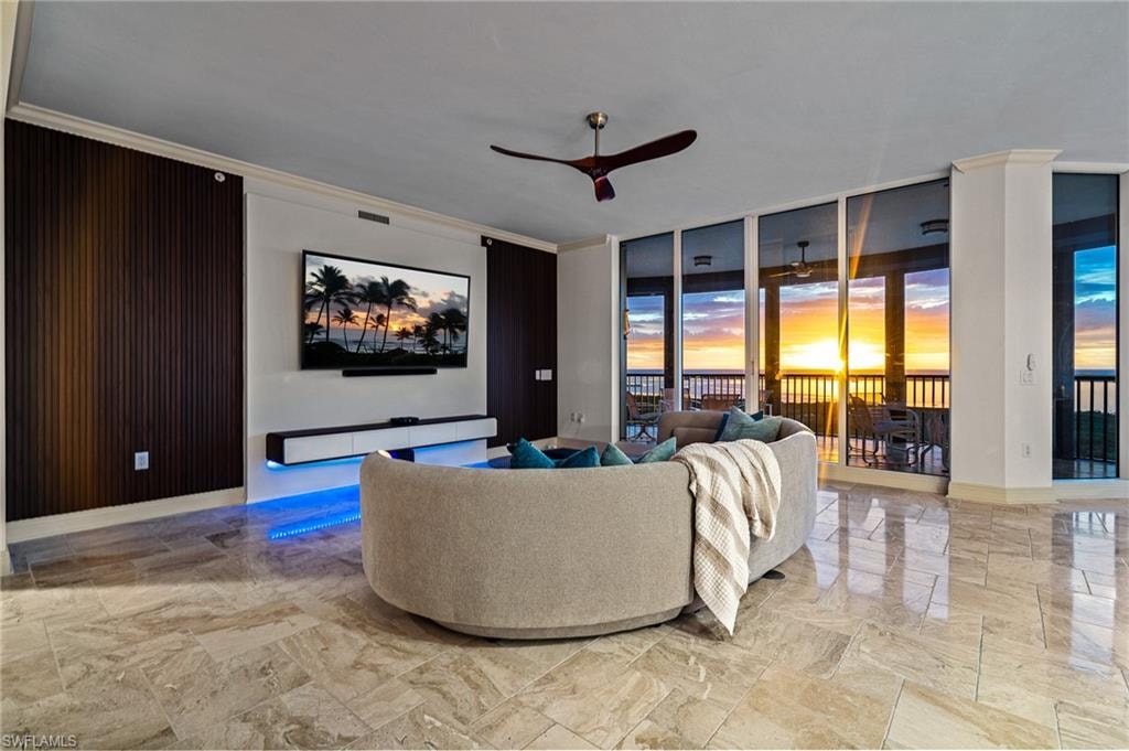 Sunroom / solarium with a water view and expansive windows
